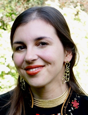 A headshot of Hannah Silverblank, standing outside and smiling. 