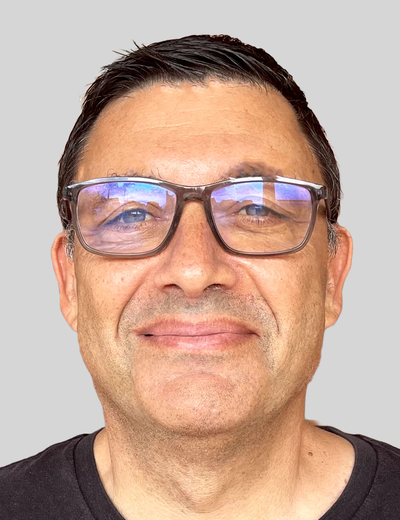 A headshot of Mark Fleishman, smiling.