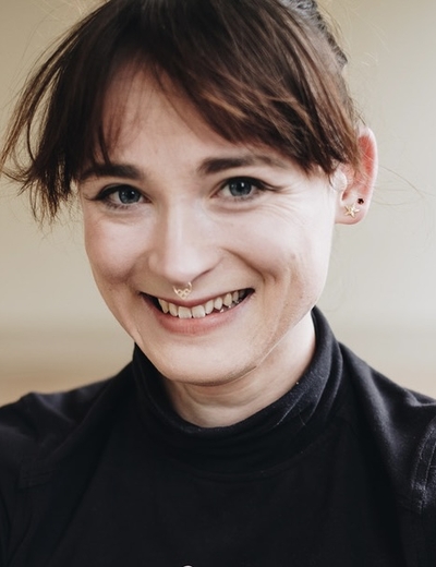 A headshot of Claire Barnes, smiling. 