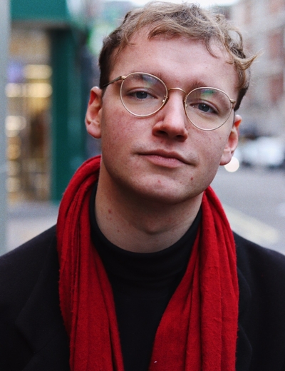 A headshot of Marcus Bell, standing outside. 