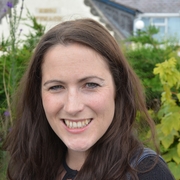 A photo of Rosie Wyles standing outside, smiling.