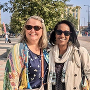 Photograph of Arlene Holmes-Henderson and Mai Musié, outdoors, on a sunny day.