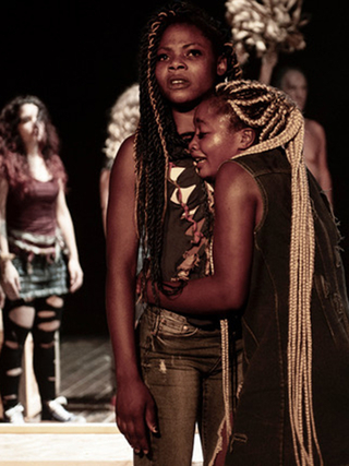 A production photograph of Antigone Power, 2018, by Sutta Scupa, depicting Glory Arekekhuegbe and Kassie Sunday as Antigone and Ismene