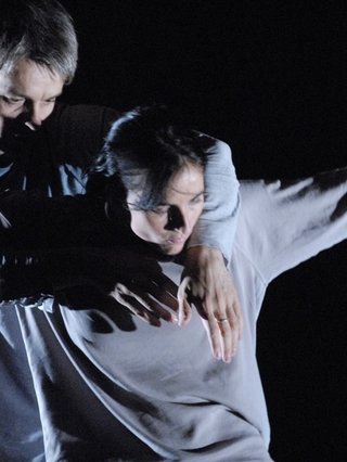 A photo of two actors in 'Dust' choreographed by Cathy Marston.