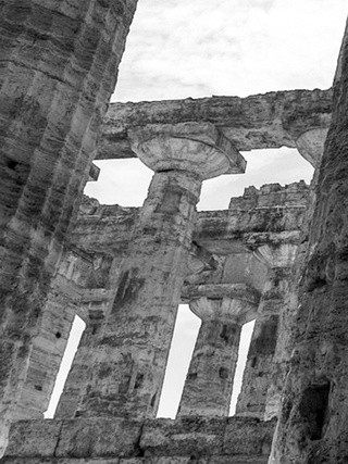 Close-up black and white photograph of ruins of Paestum