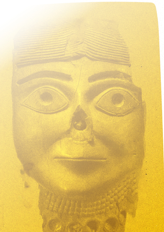 A yellow-tinted image of a crumbling bust.