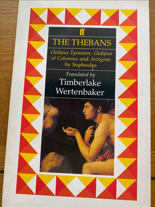 Photograph of a book on a table; title of the book is The Thebans translated by Timberlake Wertenbaker